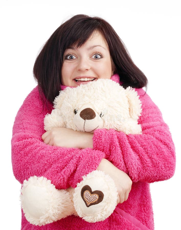 Woman in Pink Bathrobe Cuddling with her Teddy Bear stock photo
