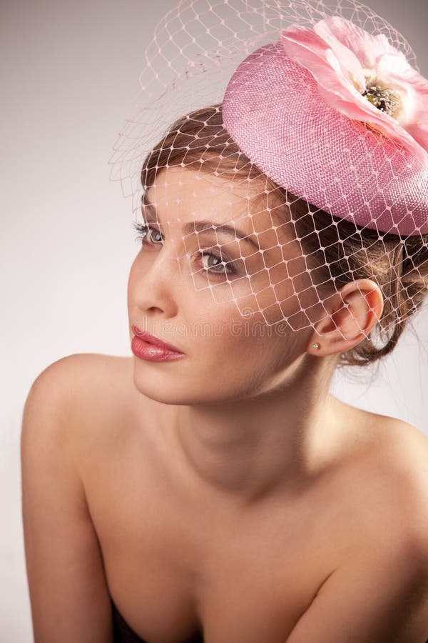 Woman in pink bonnet with voile