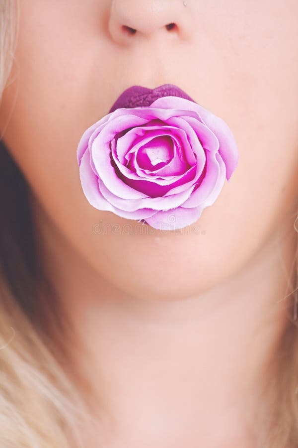 Woman With Pink Flower In The Mouth Picture. Image: 111685530