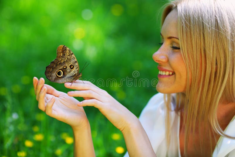 Woman playing with a butterfly