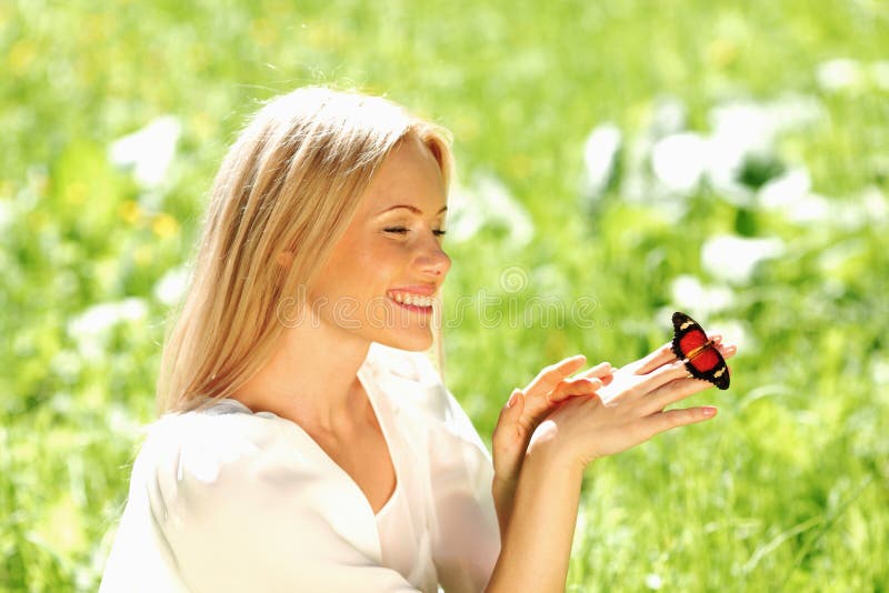 Woman playing with a butterfly