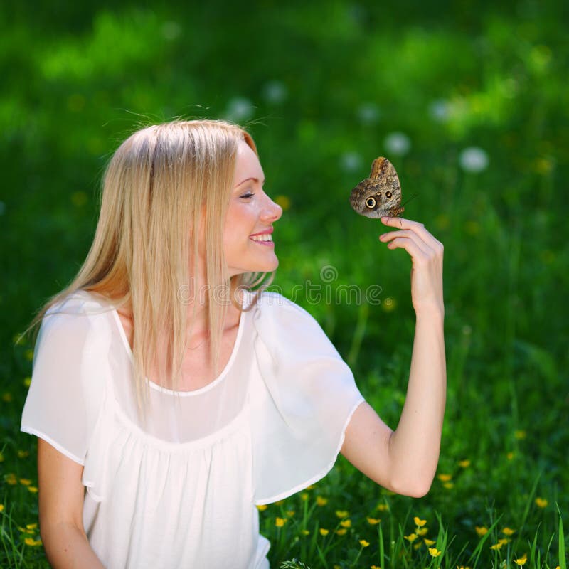 Woman playing with a butterfly