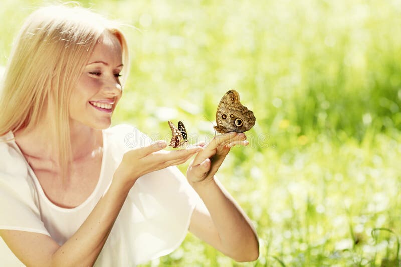 Woman playing with butterfly