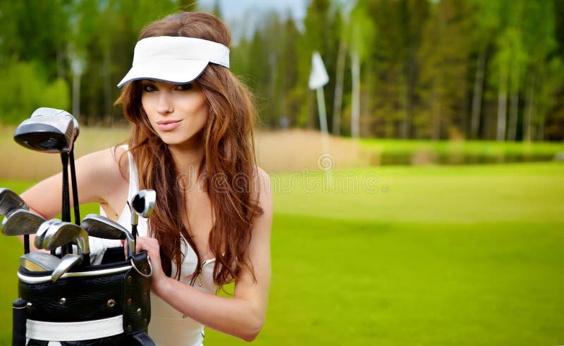 Woman playing golf on a green