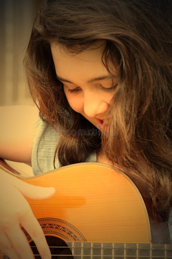 woman playing guitar