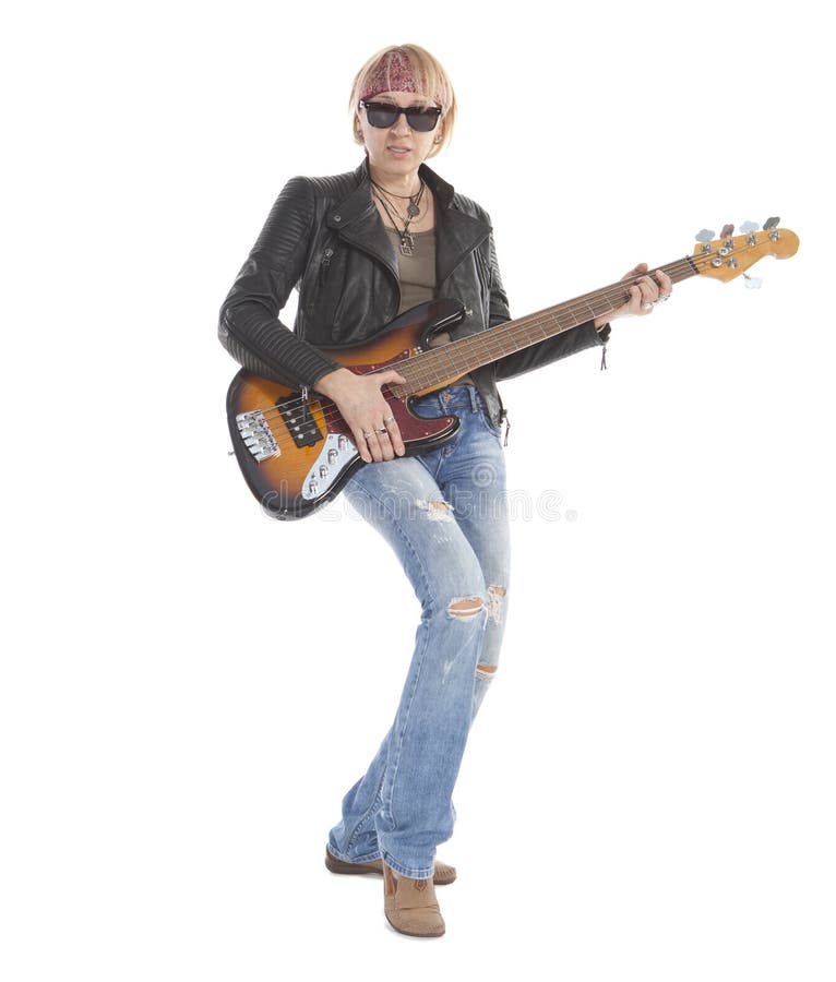 Woman with long legs playing guitar, wearing torn blue jeans and sunglasses, standing, looking at camera. Isolated on white. Woman with long legs playing guitar, wearing torn blue jeans and sunglasses, standing, looking at camera. Isolated on white