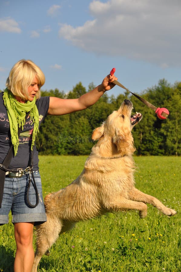 Woman playing with her dog