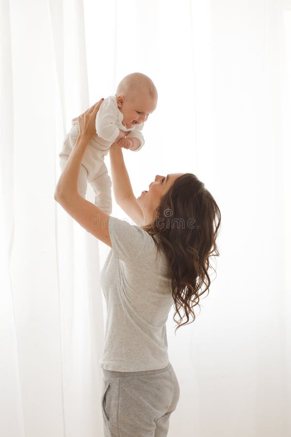 Woman playing with infant child