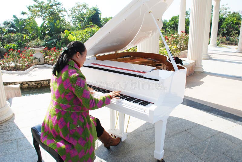 The woman playing piano