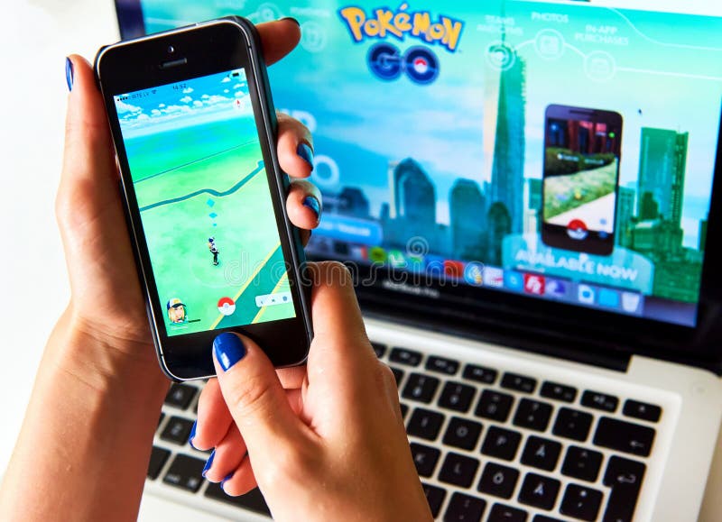 Woman sitting in a car and playing a Pokemon Go game Stock Photo - Alamy