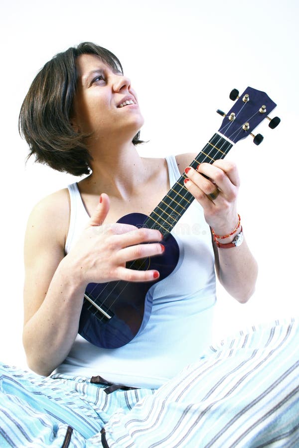 Woman playing ukulele stock image Woman playing ukulele stock image