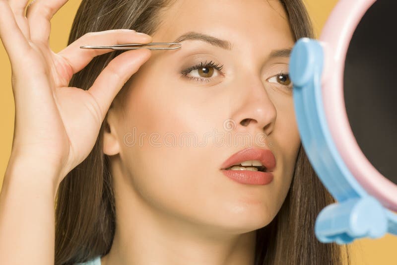 Woman Plucking Hair from Her Leg with Tweezers Stock Image Image of