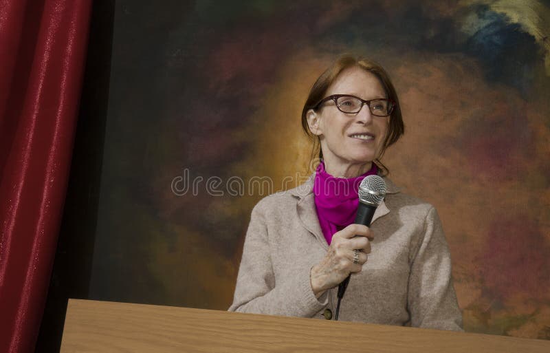 Woman at podium with microphone_1