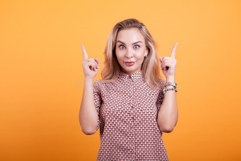 Woman pointing Young beautiful woman showing