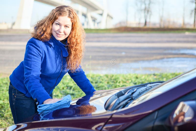 Woman polishing car cowl stock image. Image of cowl, attractive 29094177
