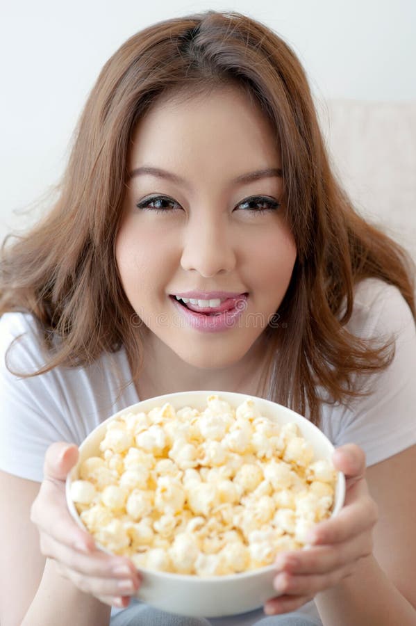 Woman with popcorn stock photo. Image of dream, movie 26680222