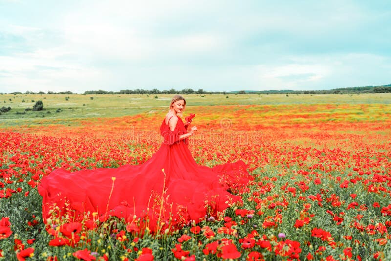 Woman Poppy Field Red Dress. Happy Woman in a Long Red Dress in a ...