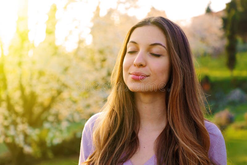 Woman portrait breathing deep fresh air with nature in background royalty free stock photography Woman portrait breathing deep fresh air with nature in background royalty free stock photography