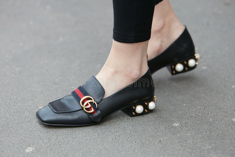 Woman with Gucci Shoes with Pearl Decoration before Prada Fashion