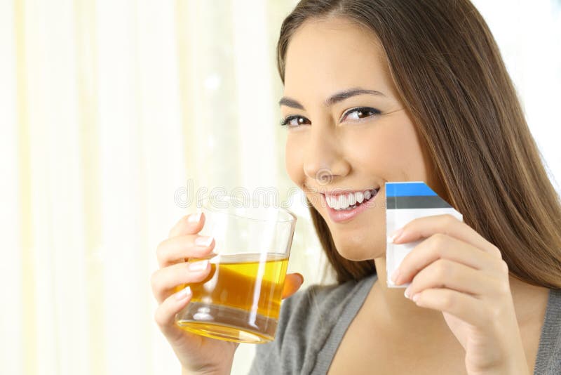 Woman posing with soluble medicine at home