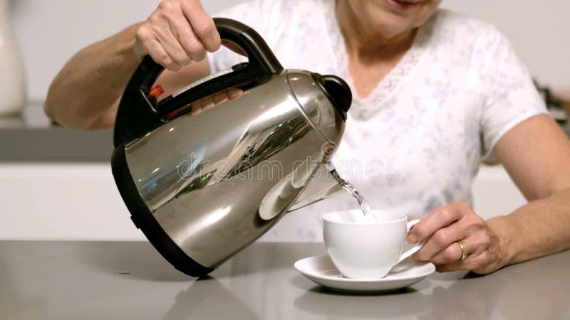 Pouring Hot Water into a Coffee Cup Stock Video - Video of shiny, motion:  61664771