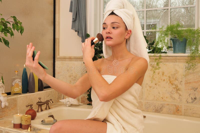 Woman powdering her face