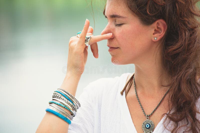 Woman practice yoga breathing techniques outdoor