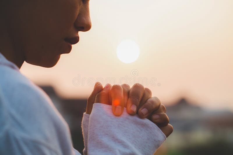 Woman praying in the morning on the sunrise background. Christianity concept. Pray background. Faith hope love concept royalty free stock photography Woman praying in the morning on the sunrise background. Christianity concept. Pray background. Faith hope love concept royalty free stock photography