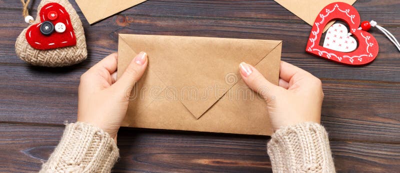 Woman preparing handmade envelope for wrapping on Valentine's Day. Valentine day concept with copyspace. Day copyspace stock images, royalty-free photos and pictures