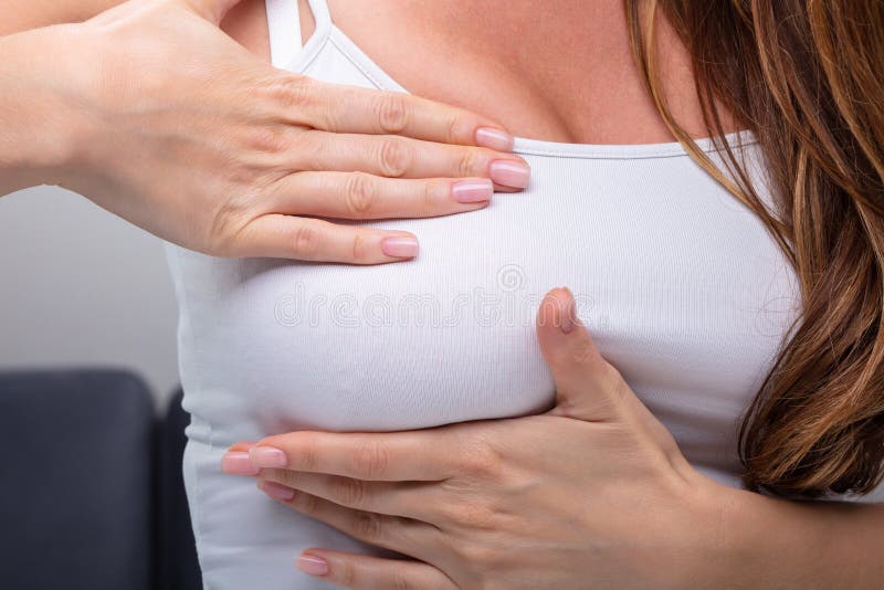 Woman Pressing Her Breast stock image. Image of person - 181835685