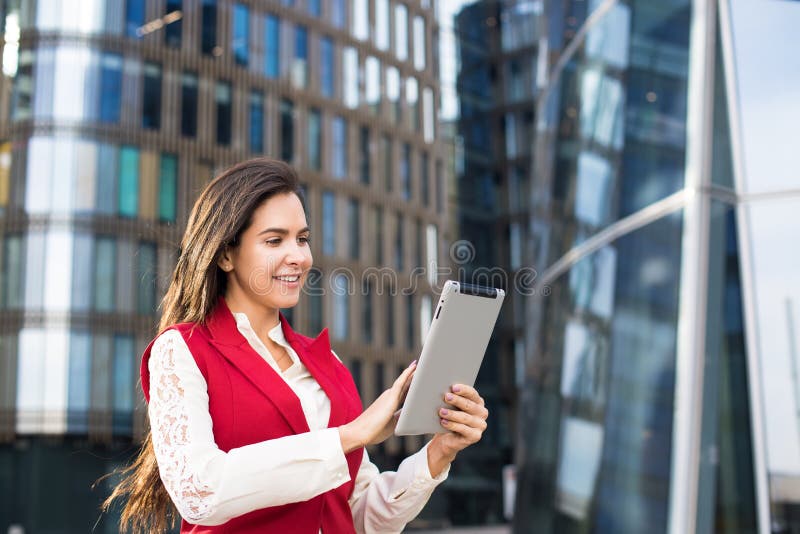 Female bookkeeper checking notifications on digital tablet stock images Female bookkeeper checking notifications on digital tablet stock images