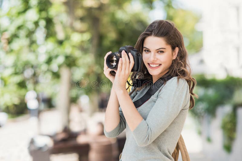 Woman Professional Photographer with Dslr Camera Outdoors Portrait. Pretty Young Girl in the City Taking Images with Photo Camera Stock Photo - Image of outside, model: 173232258 Woman Professional Photographer with Dslr Camera Outdoors Portrait. Pretty Young Girl in the City Taking Images with Photo Camera Stock Photo - Image of outside, model: 173232258