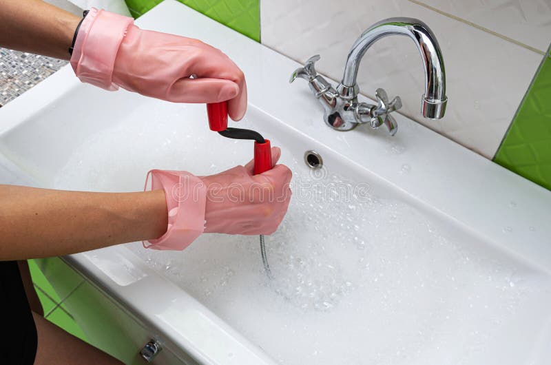 https://thumbs.dreamstime.com/b/woman-protective-rubber-gloves-unblocking-clogged-sink-probe-drained-cable-home-young-cleaning-bathroom-273261602.jpg