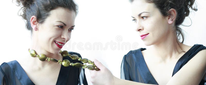 Woman pulling her beads from the neck