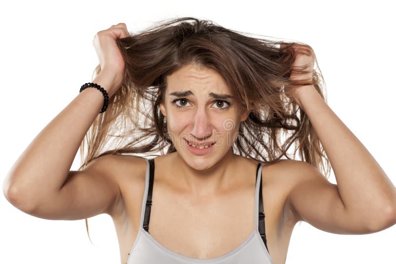 Woman pulling her hair stock photo. Image of pulling 91373680