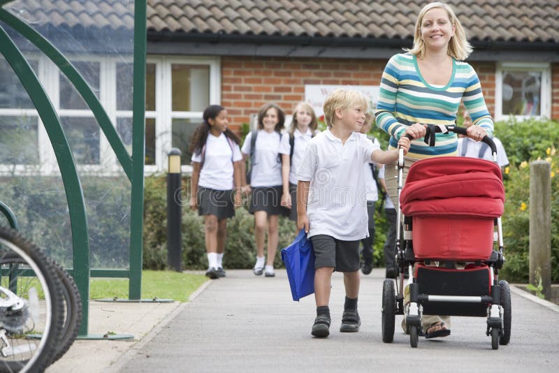 A woman with a pushchair with her son