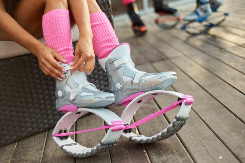 Woman Put on Kangoo Jumps Boots before Outdoor Fitness Workout Stock Photo  - Image of energy, action: 125151298