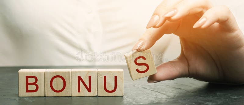 Woman puts wooden blocks with the word Bonus. Receive bonuses, rewards and preferences. Getting benefits and extra points. Bonus