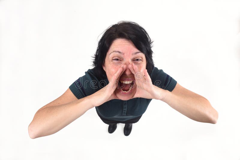 Woman putting a hand in mouth and is screaming on white background.