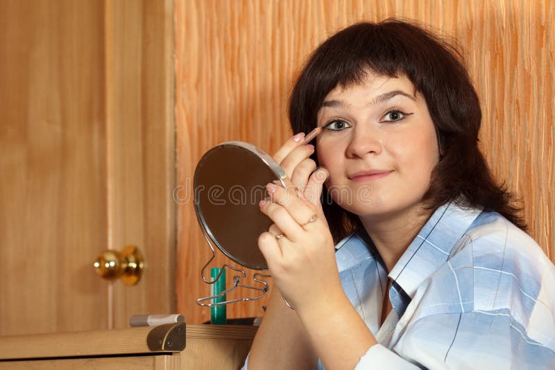 Woman putting make up