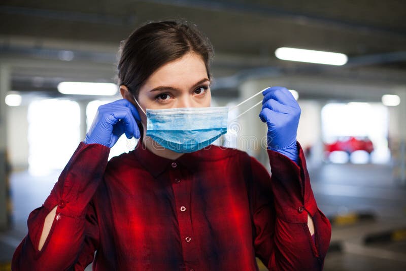 Woman putting mask on stock photo. Image of health, pollution - 201790944