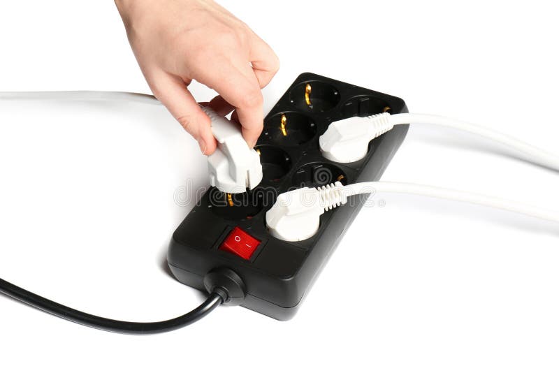 Woman putting plug into extension cord on white background, closeup. stock photography Woman putting plug into extension cord on white background, closeup. stock photography