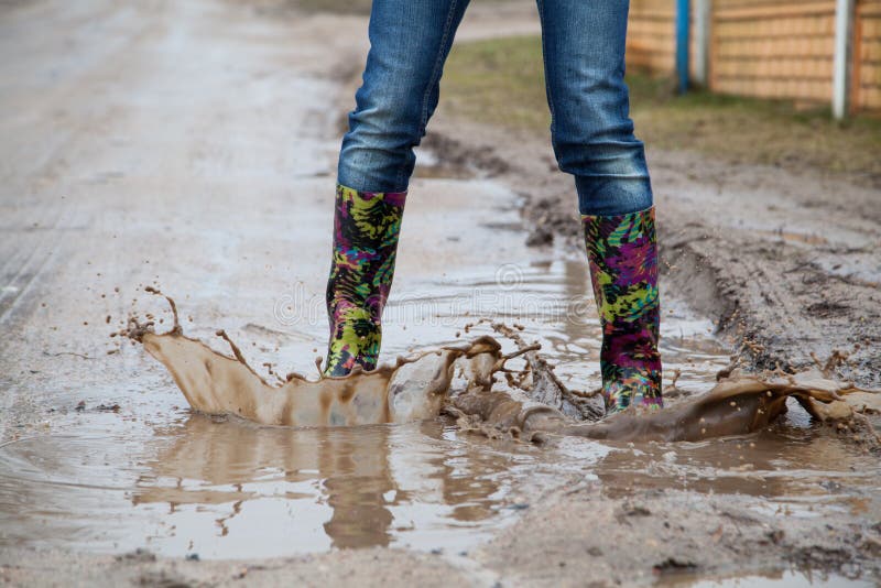 Woman with Rain Boots Jumps Stock Photo Image of splashing, galoshes