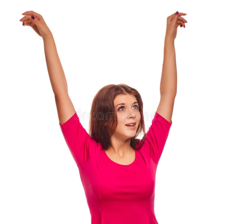 Happy woman raised hands up happy success look in a pink dress isolated.