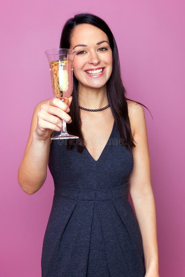 Woman raising a glass of champagne