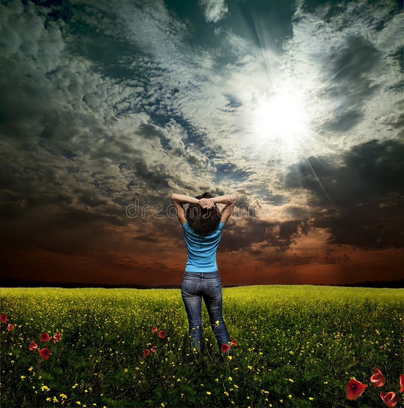 Woman and rapeseed field