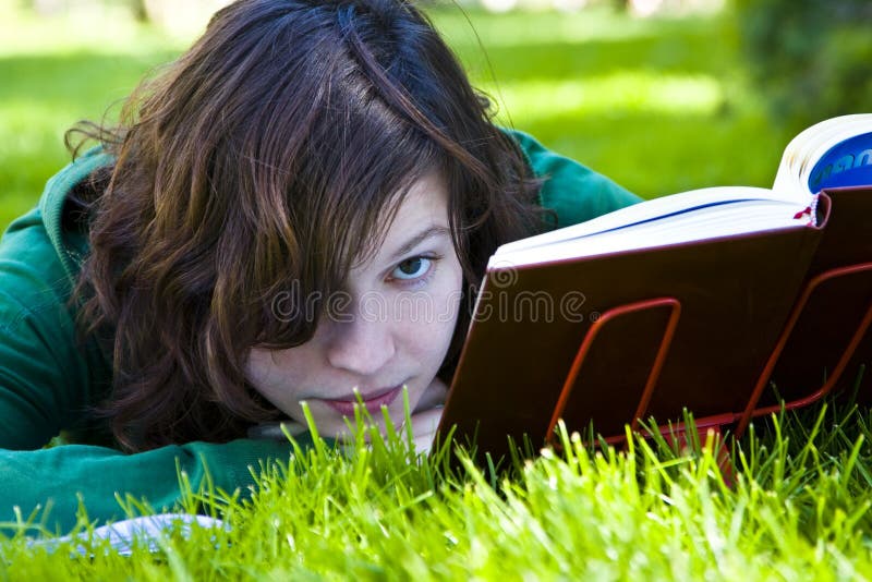 Woman reading on grass