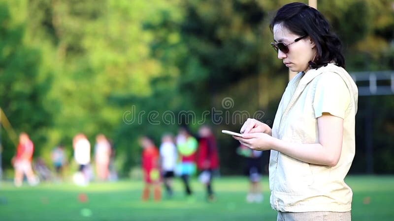 Woman reading mobile phone message