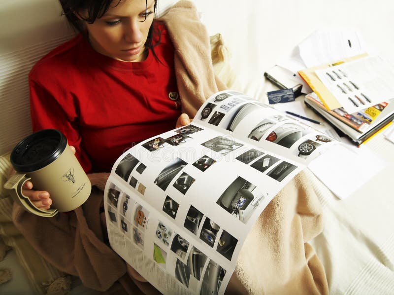 Woman is reading a new car booklet