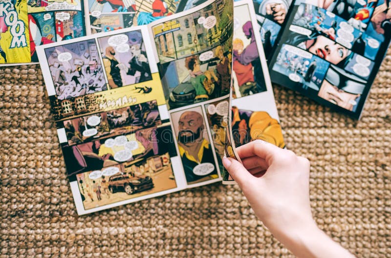 Woman reads comic book on the carpet at home